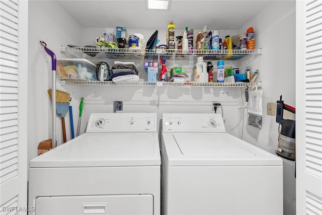 laundry area featuring laundry area and washer and clothes dryer