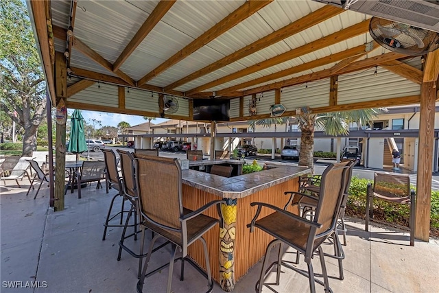 view of patio with outdoor dry bar