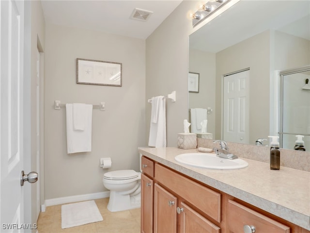 full bath with visible vents, toilet, a stall shower, vanity, and baseboards