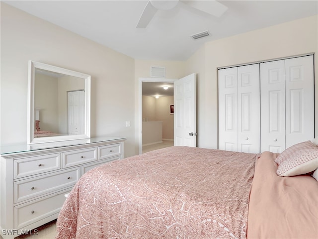 bedroom featuring ceiling fan, a closet, and visible vents