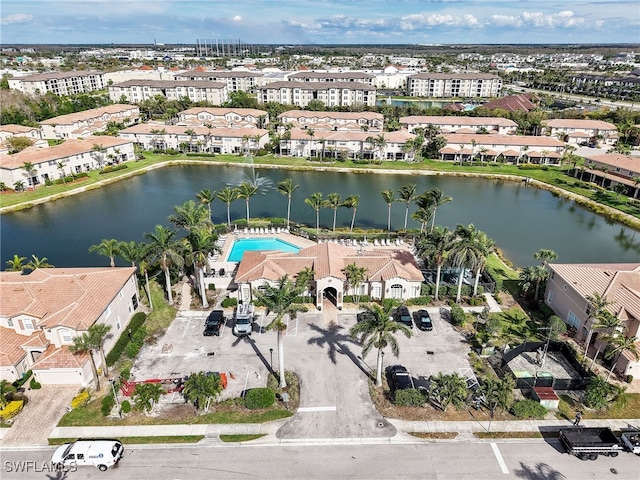 bird's eye view with a water view and a residential view