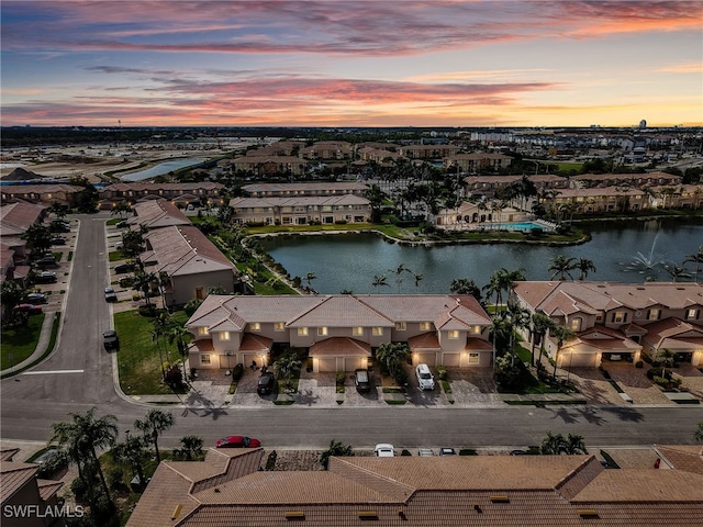 bird's eye view featuring a water view and a residential view