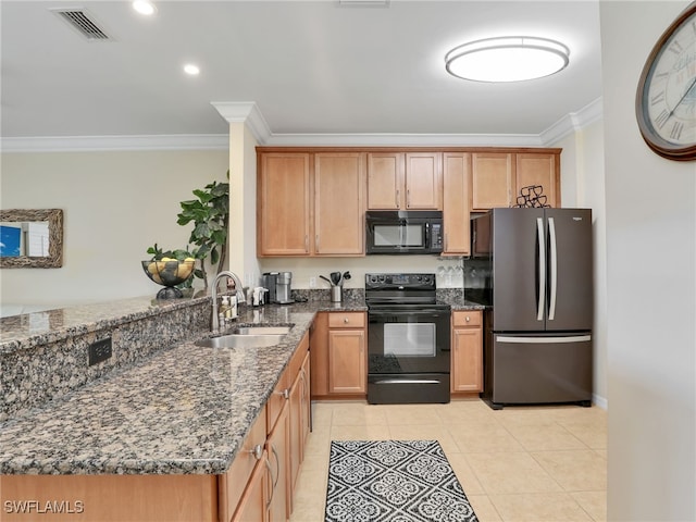 kitchen with visible vents, dark stone counters, ornamental molding, black appliances, and a sink