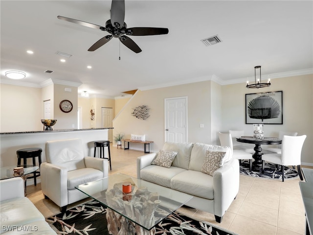 living area featuring recessed lighting, visible vents, ornamental molding, light tile patterned flooring, and ceiling fan with notable chandelier