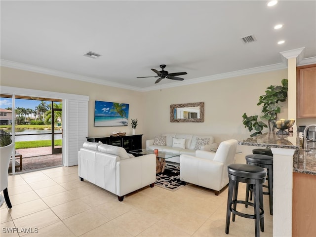 living room featuring light tile patterned flooring, visible vents, and crown molding