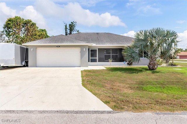 ranch-style house with a garage, driveway, a front lawn, and stucco siding