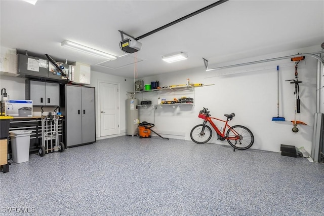 garage featuring a garage door opener and electric water heater