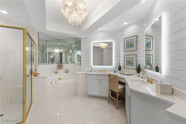 full bathroom with a chandelier, a stall shower, tile patterned flooring, and a garden tub