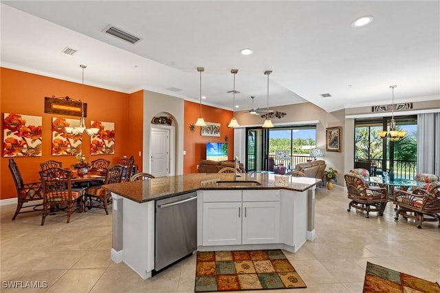 kitchen featuring dishwasher, a sink, visible vents, and an inviting chandelier