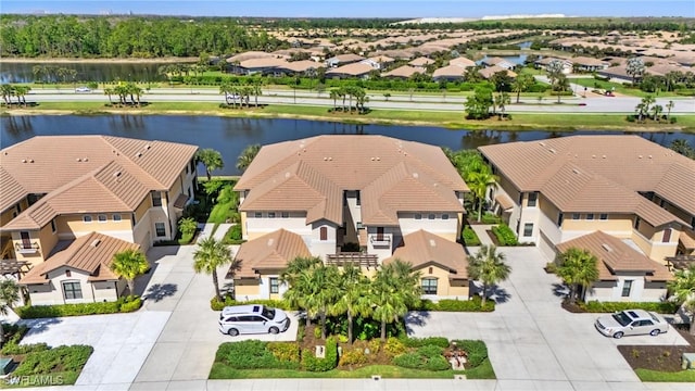 aerial view with a water view and a residential view