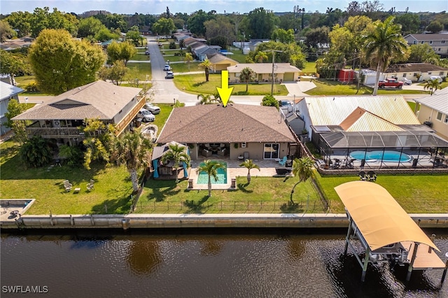 bird's eye view with a water view and a residential view