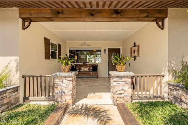 property entrance with stucco siding