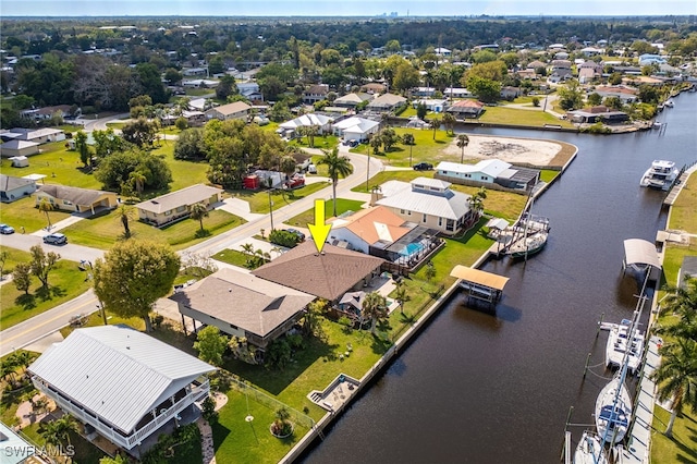 bird's eye view with a residential view and a water view