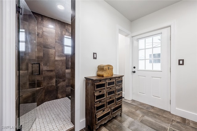 interior space featuring baseboards and a healthy amount of sunlight