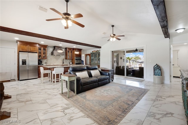 living area featuring high vaulted ceiling, marble finish floor, visible vents, and baseboards