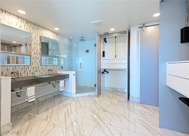 full bath with marble finish floor, double vanity, a stall shower, and recessed lighting