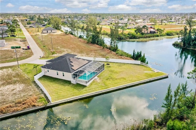 birds eye view of property featuring a residential view and a water view