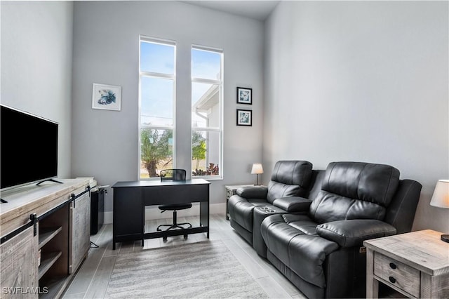 home office with a wealth of natural light and baseboards