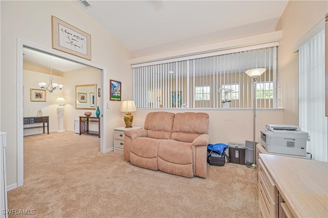 living area with lofted ceiling, carpet floors, visible vents, and a notable chandelier