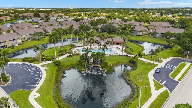 bird's eye view featuring a water view and a residential view