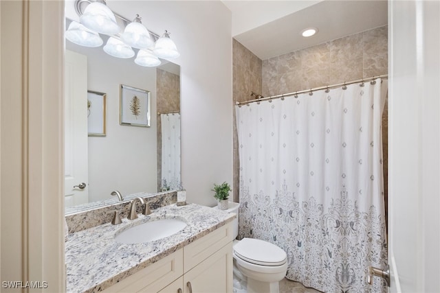 full bathroom featuring curtained shower, vanity, and toilet