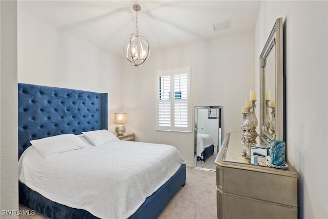 bedroom featuring light carpet, baseboards, and a notable chandelier