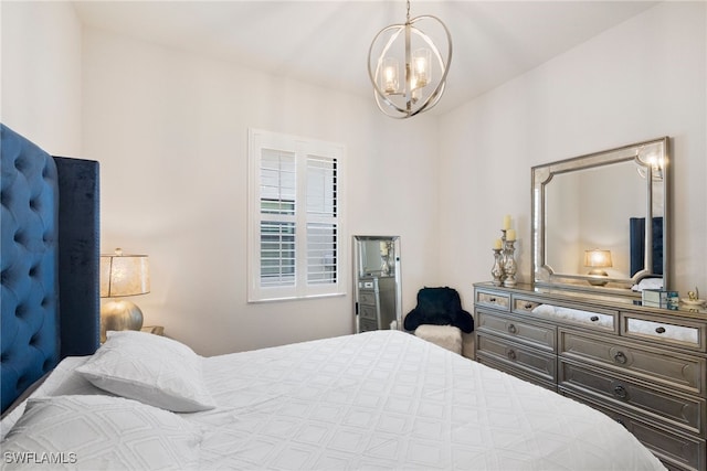 bedroom with a notable chandelier