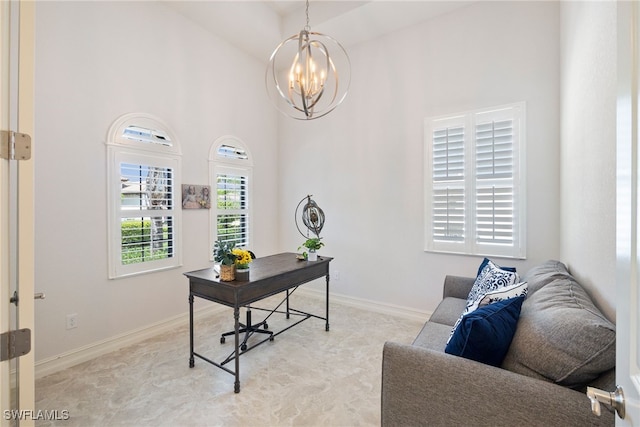 home office featuring a high ceiling, baseboards, a notable chandelier, and light colored carpet