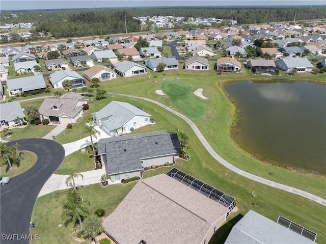 bird's eye view featuring a water view and a residential view