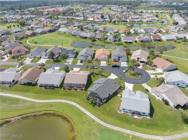 aerial view with view of golf course, a water view, and a residential view