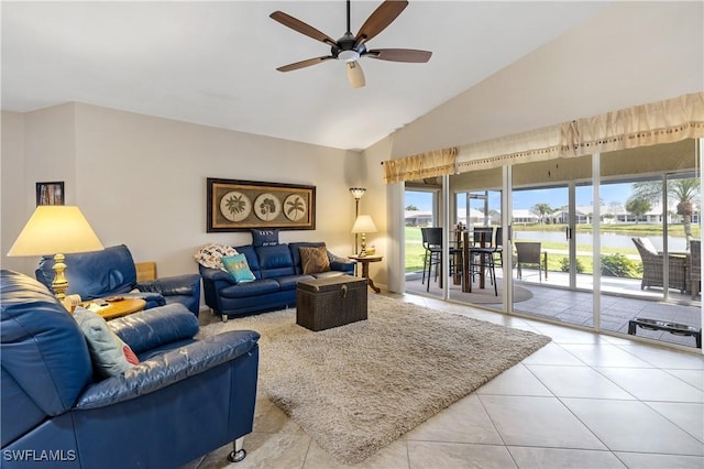 living room with high vaulted ceiling, a water view, tile patterned flooring, and a ceiling fan