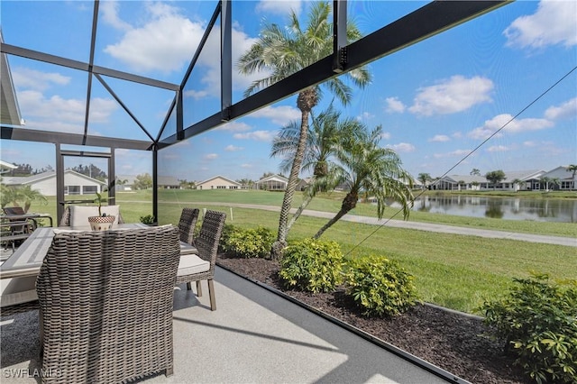 unfurnished sunroom with a water view