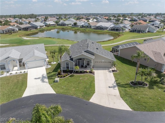 aerial view with a water view and a residential view