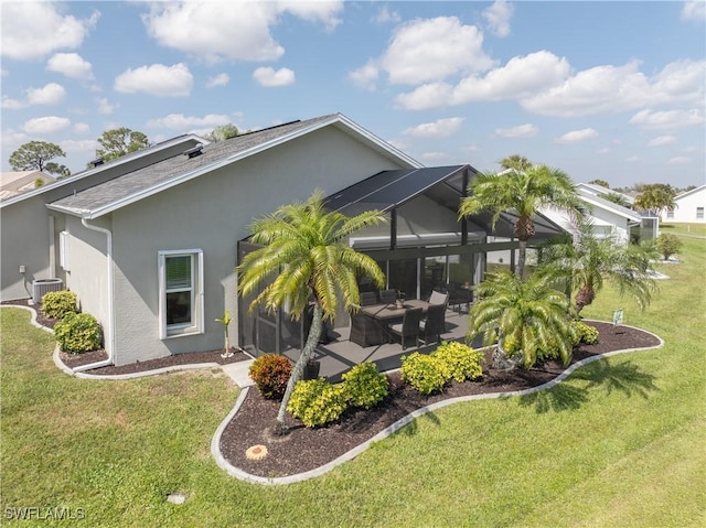 view of property exterior with a patio area, glass enclosure, a lawn, and stucco siding