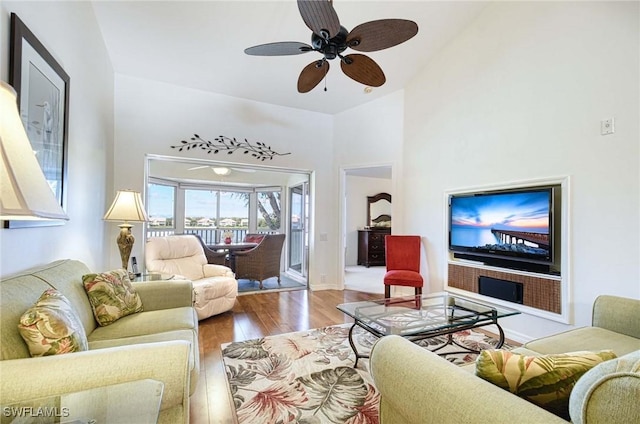 28068 Cavendish Ct Unit 2308, Bonita Springs, FL 34135 - living area with wood finished floors, a ceiling fan, and high vaulted ceiling