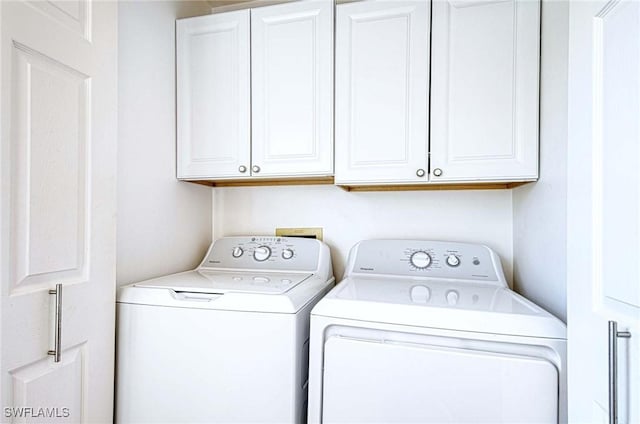 laundry area featuring cabinet space and independent washer and dryer