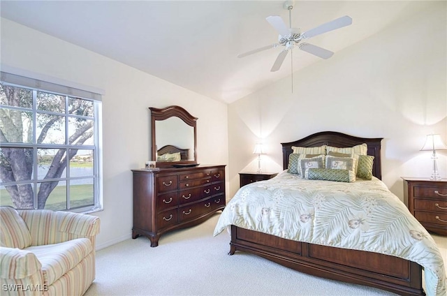 carpeted bedroom with lofted ceiling and ceiling fan