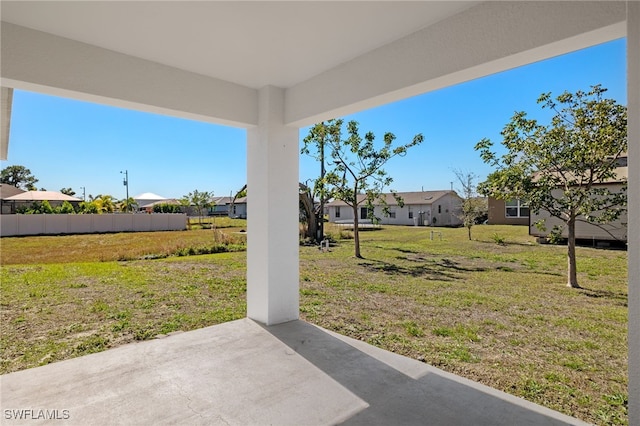 view of yard with a residential view and a patio