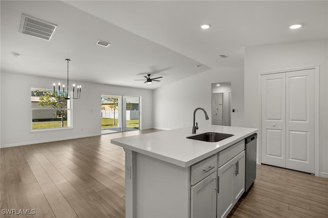 kitchen with dishwasher, open floor plan, a sink, and visible vents