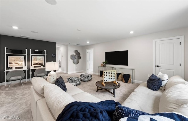 living area featuring recessed lighting, light colored carpet, and baseboards