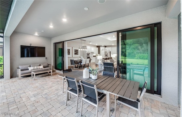 view of patio featuring outdoor dining space and outdoor lounge area