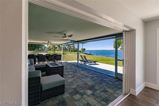 view of patio / terrace with ceiling fan and outdoor dining space