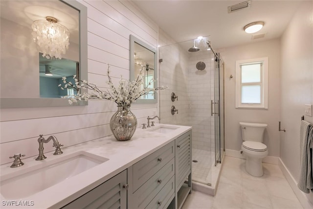 bathroom with a sink, visible vents, and a shower stall