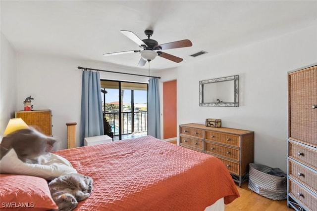 bedroom featuring light wood finished floors, access to outside, visible vents, and ceiling fan