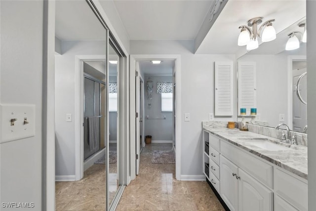 full bathroom featuring vanity and baseboards