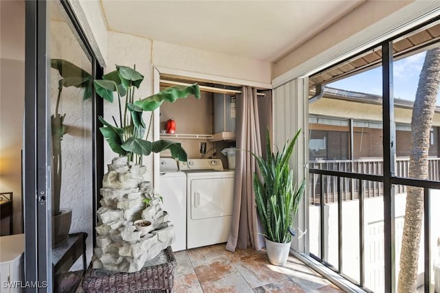 unfurnished sunroom featuring independent washer and dryer