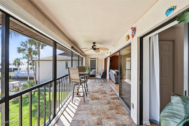 exterior space featuring a ceiling fan