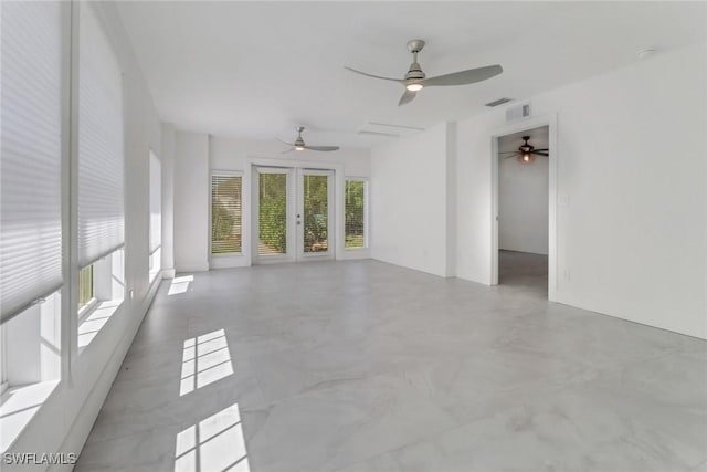 unfurnished room with visible vents and french doors