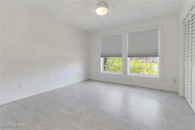 empty room featuring a ceiling fan