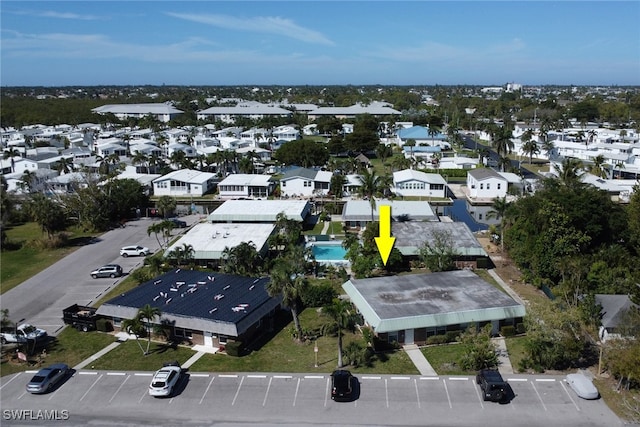 birds eye view of property with a residential view